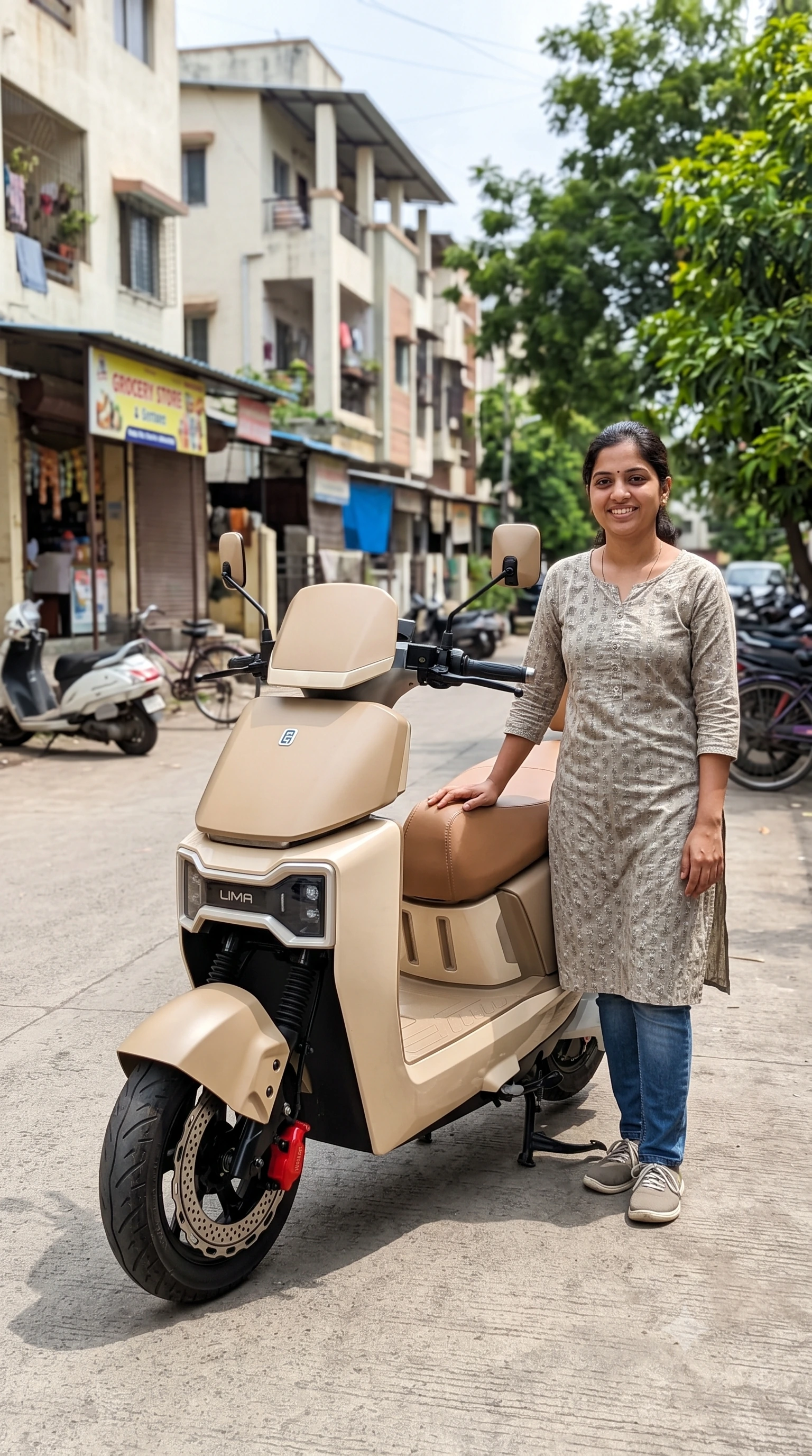GreenSpark Lima electric scooter with rider